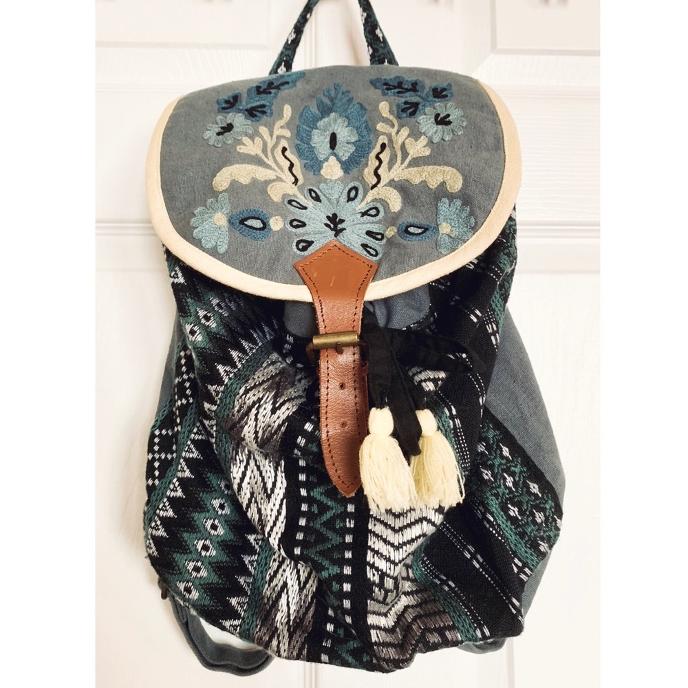 Small, buckle strap backpack